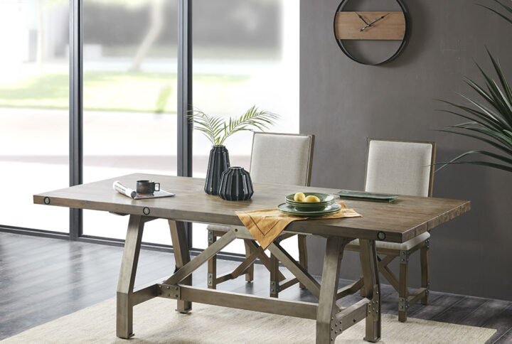 Make the INK+IVY Lancaster Dining Table the centerpiece for your dining room decor. The bold industrial inspired look will create a warm gathering place. The dining table features a solid wood