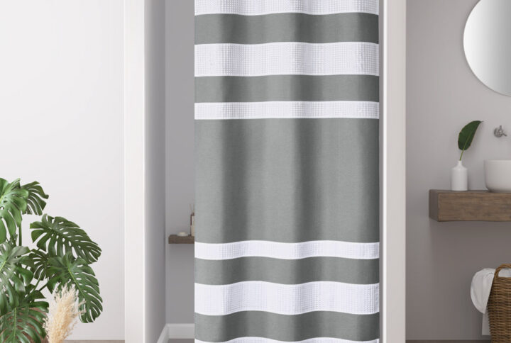 Update your space with the Madison Park Spa Waffle Shower Curtain with 3M Treatment. Featuring a fresh and updated stripe design