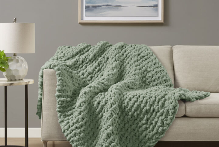 Indulge in pure comfort by wrapping yourself in the Madison Park Chenille Chunky Knit Throw. This chunky knit throw is handmade from luxurious chenille yarn to create a soft and cozy feel that's perfect to snuggle up in. The chunky knit throw is also OEKO-TEX certified