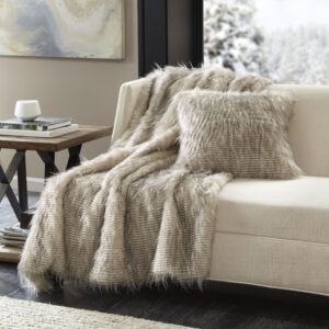 creating a beautiful and rich texture. A solid faux mink reverse adds another layer of lush softness. Toss this throw over your sofa or drape it across your bed to add a sophisticated and lavish update to your room.