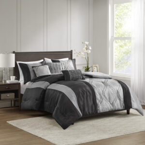 This traditional jacquard comforter set features an elegant ogee design pieced with solid stripes in a vertical layout for an opulent bedroom update. The three throw pillows featuring pintucks