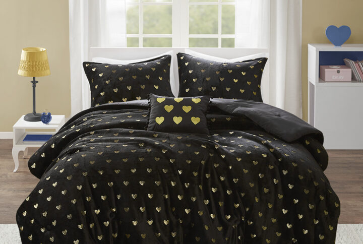 The Mi Zone Rosalie Metallic Printed Plush Comforter Set brings a bright and casual update to your bedroom. A gold metallic heart print adorns the black plush comforter and shams (1 in Twin/TwinXL) creating a soft and fun look. An oblong decorative pillow with a pompom trim and embroidered hearts adds a lovely touch to the bedding set. The hypoallergenic polyester comforter filling contains no allergens and is treated to be dustproof