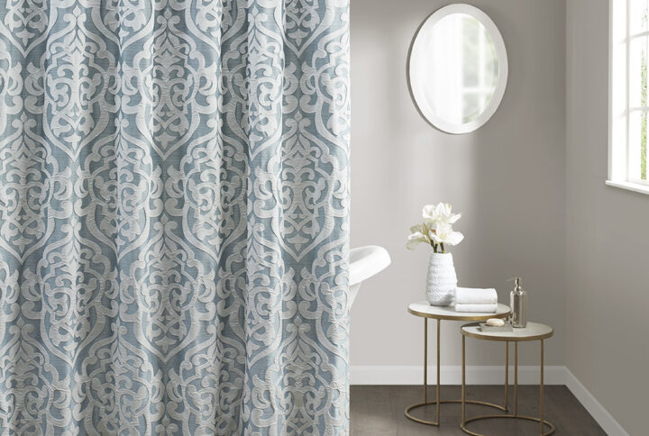 Add a touch of class to your bathroom with our Madison Park Odette Jacquard Shower Curtain. This luxurious textured shower curtain flaunts a gorgeous silver damask medallion design on a stria aqua jacquard ground that adds rich texture and dimension to the lavish look. Measuring 72x72"