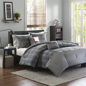 The Intelligent Design Daryl Comforter Set combines modern design with classic colors to create a sharp look. This comforter features a grey and white plaid print with a pieced design at the foot that is accented with button detailing. The 2 matching shams (1 in Twin/TwinXL) mirror the pieced look of the comforter