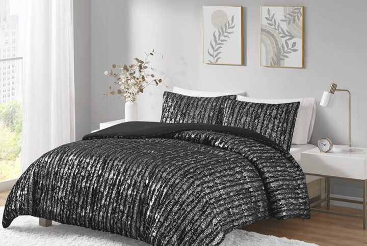 The Naomi comforter set features an eye-catching metallic design on soft faux fur that's sophisticated and modern. This faux fur comforter adds sparkle to your bedroom with its metallic accents