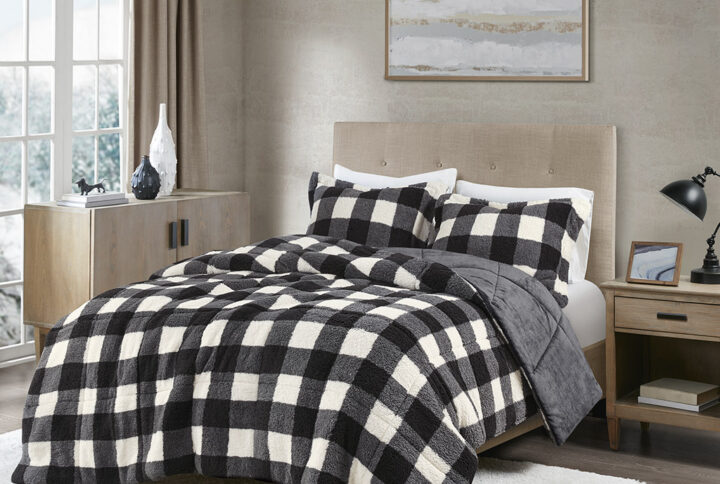 Bring a cozy look to your bedroom with the True North by Sleep Philosophy Brooks Print Sherpa Down Alternative Comforter Set. The comforter features an ivory and black buffalo check print with a plush reverse