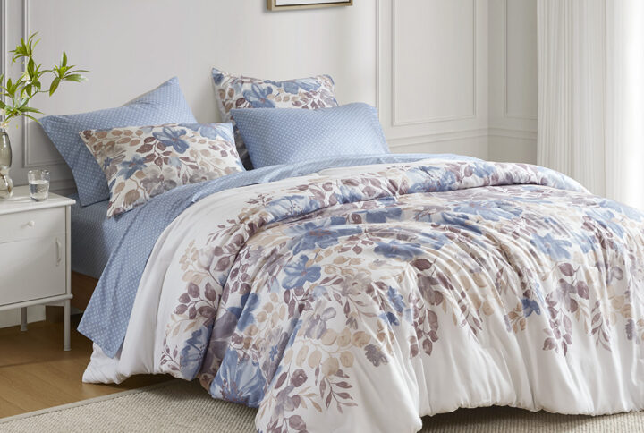 Create a calming oasis in the bedroom with the Madison Park Essentials bed-in-a-bag. This beautiful comforter set features a blue and grey watercolor floral print across the center of the white bedding