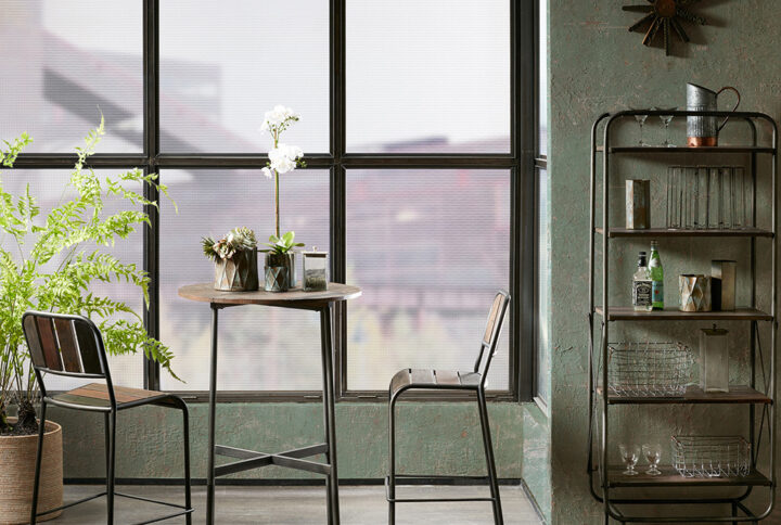 The INK+IVY Renu Bar Table brings a bold and industrial charm to your kitchen decor. This round bar table features a palette style table top that has varied tones of brown to create dimension and a unique look. The metal legs and stretcher displays a gun metal finish to complement the top