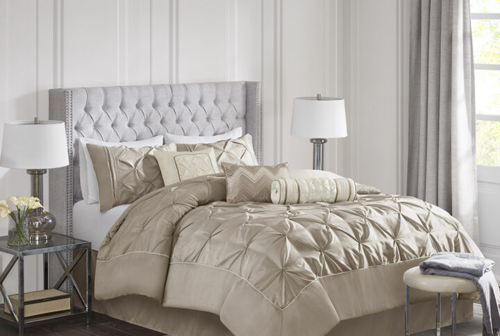 This beautifully tufted bed is from the Laurel bedding collection. Its neutral taupe coloring makes this set easy to accessorize in your bedroom. The collection is made from 100% polyester polyoni and has pieced fabric sewn together to give this set dimension. It is finished with a smooth edge of fabric that creates a beautiful border around this comforter. Items in the set may come in a rolled or compressed packaging