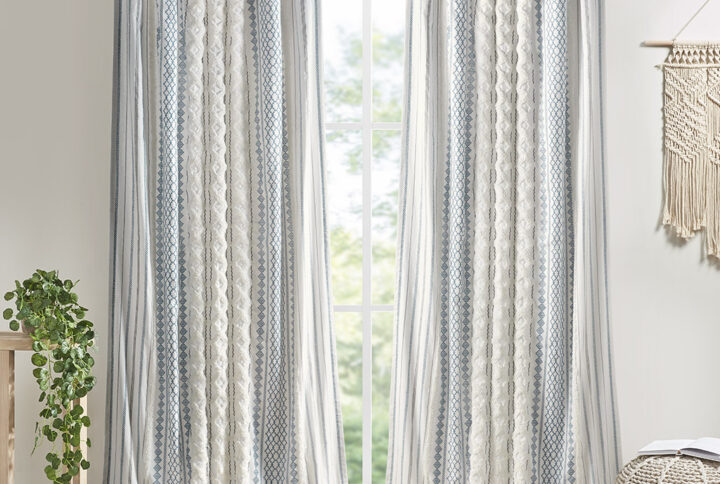 The INK+IVY Imani Cotton Printed Window Panel with Chenille Stripe and Lining offers a chic and casual update to your home. This white window panel features a navy geometric print with a tufted chenille stripe trim