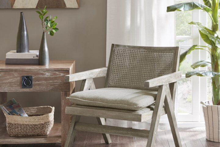 Give your home a one-of-a-kind natural update with the INK+IVY Ventura Accent Chair. This accent chair features a rattan back and a solid hardwood frame in a grey aged oak finish to create an organic appeal. The upholstered attached seat cushion provides exceptional comfort