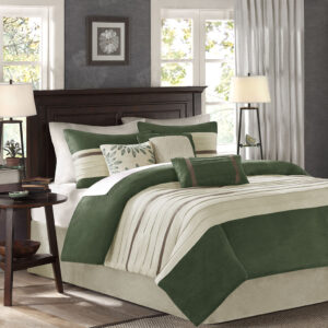 The Madison Park Palmer 7 Piece Comforter Set offers a classic and refined update to your bedroom decor. This transitional style comforter features a pieced microsuede design in rich contrasting green and beige colors to create an incredibly soft look and feel. The 2 matching shams also flaunt a pieced construction to coordinate with the faux suede comforter. A solid beige bed skirt and 3 decorative pillows with a mix of embroidered designs add the perfect finishing touches to complete this lush traditionally-inspired comforter. Machine washable for easy care