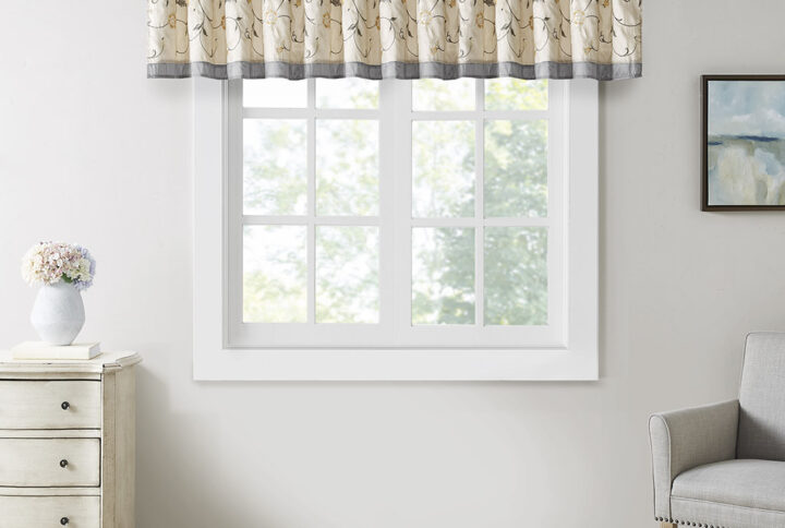 Add simple elegance to any room with the Madison Park Serene Embroidered Valance. This valance features delicate floral embroidery in soft sage and neutral hues