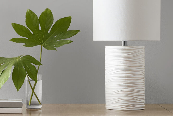 The 510 Design Crewe Textured Resin Table Lamp offers a clean and minimalistic update to your decor. Crafted from resin