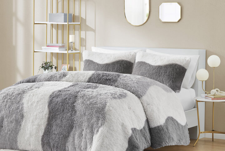 The Cassie shaggy faux fur comforter set showcases a unique