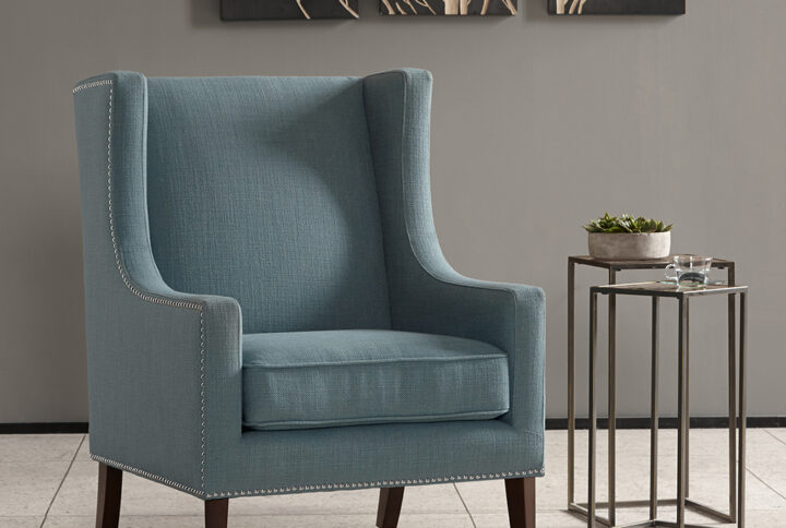 A wing back chair like this is a classic chair. Combining an updated print fabric with contrasting silver nail head