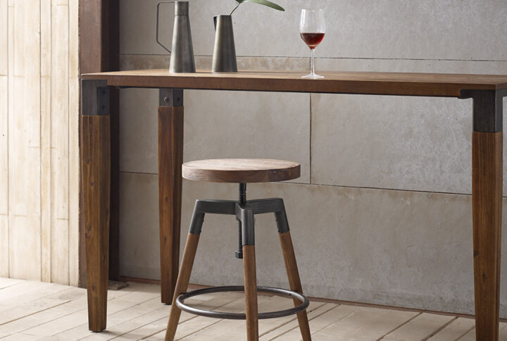 The INK+IVY Frazier Counter Stool/Barstool provides a bold industrial update to your dining room or kitchen. This counter stool features a solid wood round seat that adjusts to 2 different heights to make it either a counter stool or bar stool. A gun metal washed metal ring between the solid wood legs adds a unique footrest to the wooden stool. With its simple yet bold design