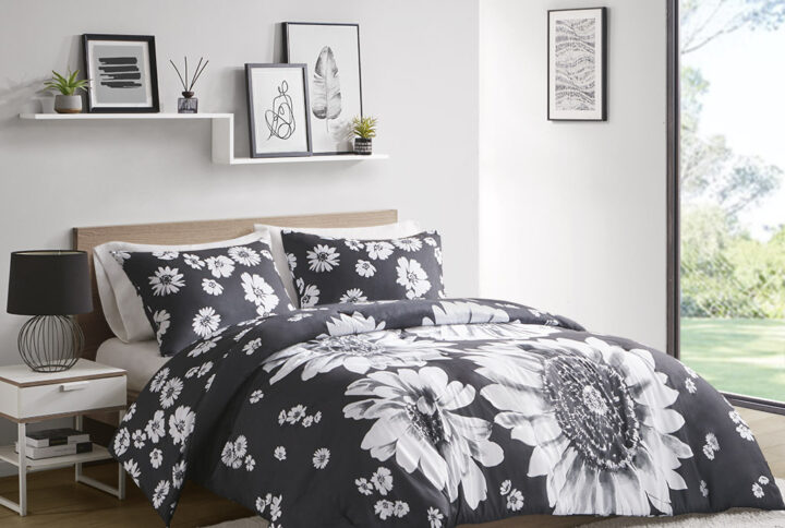 The Maude comforter set features a large scale floral design and reverses to a smaller scale floral design for 2 looks in 1.  This eye-catching black and white comforter gives your bedroom a bold and dramatic update.  The coordinating shams (1 in Twin/Twin XL) repeat the smaller scale floral design to complete the bedding set. The hypoallergenic polyester comforter filling contains no allergens and is treated to be dustproof. This machine washable comforter set also features antimicrobial treatment which keeps the fabric long lasting.