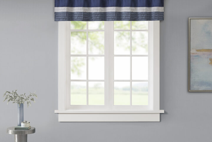 Madison Park Amherst Polyoni Pintuck Window Valance is a simple way to add style to your room. This window valance features a modern striped design in deep hues of navy