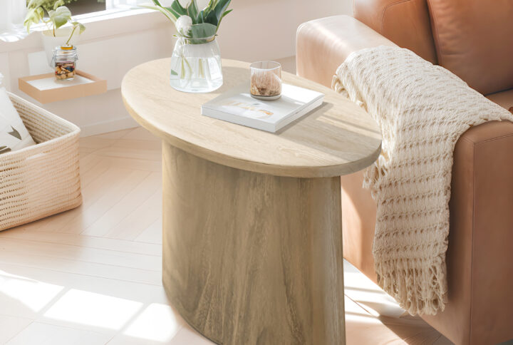 Update your space with the modern design of Chapel Hill's oval accent table. The sleek sturdy wood pedestal base creates a stunning accent piece for a variety of décor styles. Measuring 24" in diameter