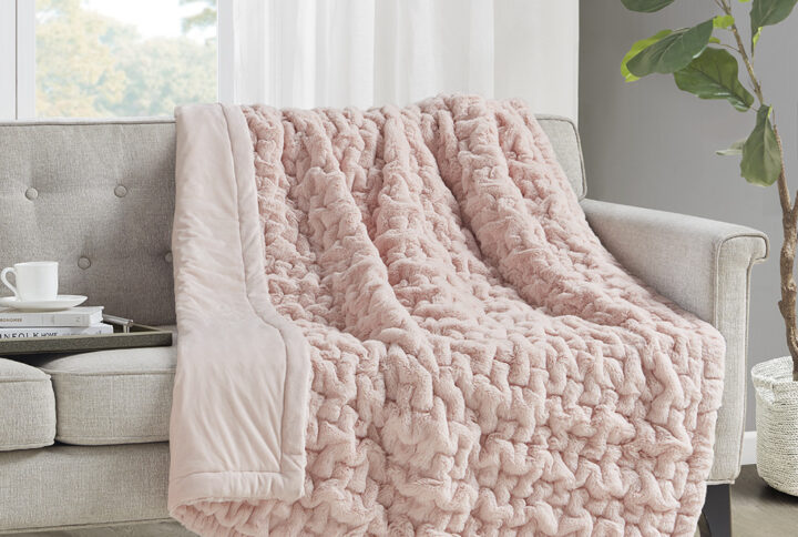 Add a modern and sophisticated touch to any space with the Madison Park Ruched Fur Throw. This throw features a solid ruched fur pattern