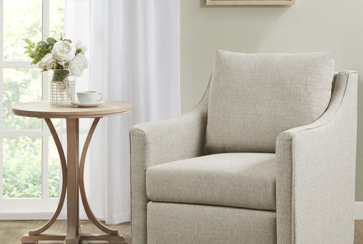 The Christian swivel armchair is part of Bedford collection by Martha Stewart. The chair has a 360 degree swivel and a classic structured look