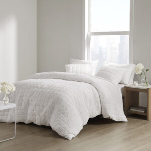 The simple elegance of the Cocoon 3 Piece Quilt Top Duvet Cover Mini Set by N Natori brings an elevated update to your bedroom. The oversized duvet cover flaunts super soft crushed microfiber with a lofty over-quilted box pattern