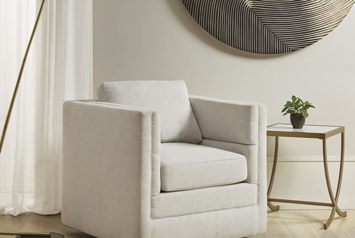 Add a clean and comfortable update to your living room with the Martha Stewart Osborne 360 Degree Swivel Chair. Upholstered in a rich cream fabric