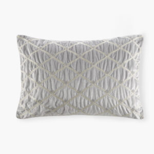 This sumptuous oblong pillow features foxtail stitched