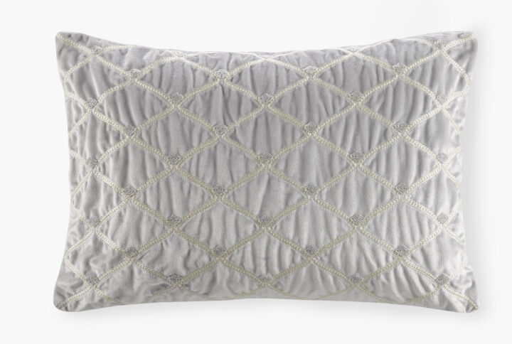 This sumptuous oblong pillow features foxtail stitched