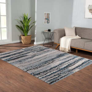 Add a modern textural touch to your living space with the Madison Park Riley Cozy Shag Watercolor Area Rug. This plush area rug flaunts cool shades of blue in a watercolor design that creates a rich contrast to easily complement your decor. The super soft