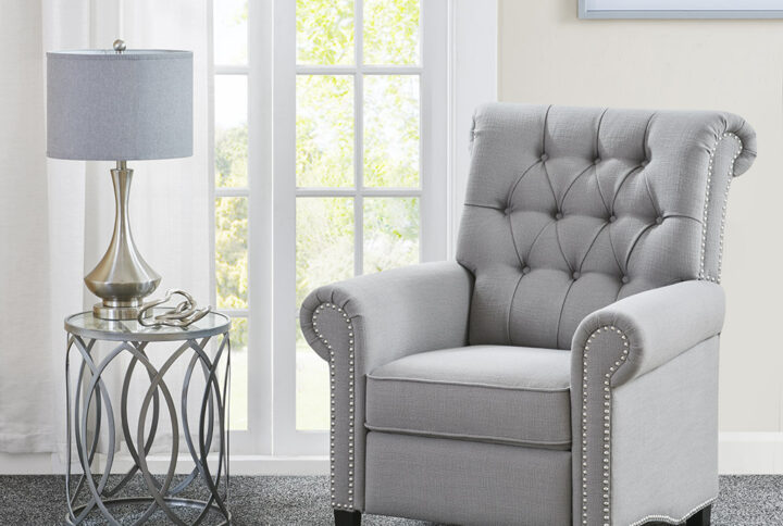 Add a sophisticated touch to your living room with the Madison Park Aidan Push Back Recliner. Featuring a high button-tufted back and rolled arms