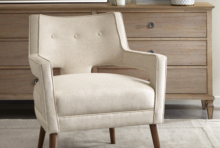 Update your space with the Madison Park Palmer Accent Chair. The open arm design and button tufted back creates a chic look fit for your living room. The beautiful cream upholstery features a small houndstooth pattern for extra charm and texture