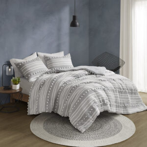 The Urban Habitat Rowan duvet cover set features cationic dyed stripes and clip jacquard pompom details that bring a perfect blend of modern and casual style to your bedroom. The duvet cover has a soft microfiber reverse