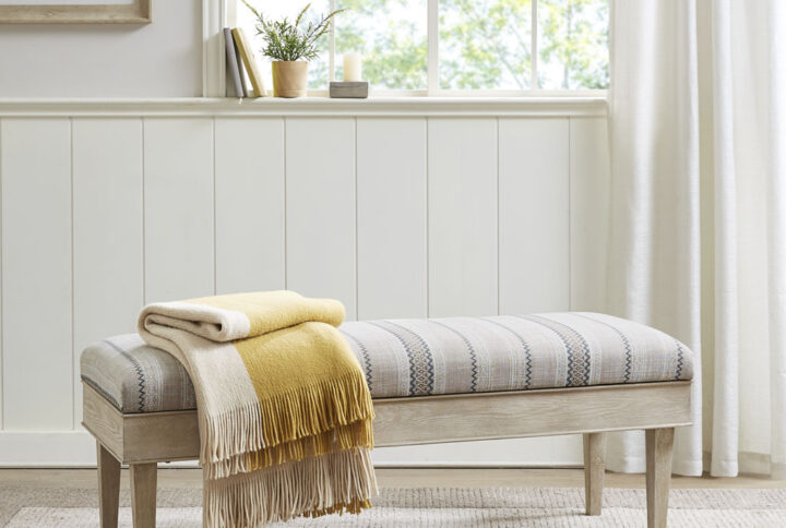 The Martha Stewart Harstrom Storage Bench provides a chic combination of style and functionality for your home decor. This storage bench features an upholstered seat that opens up to an ample storage space