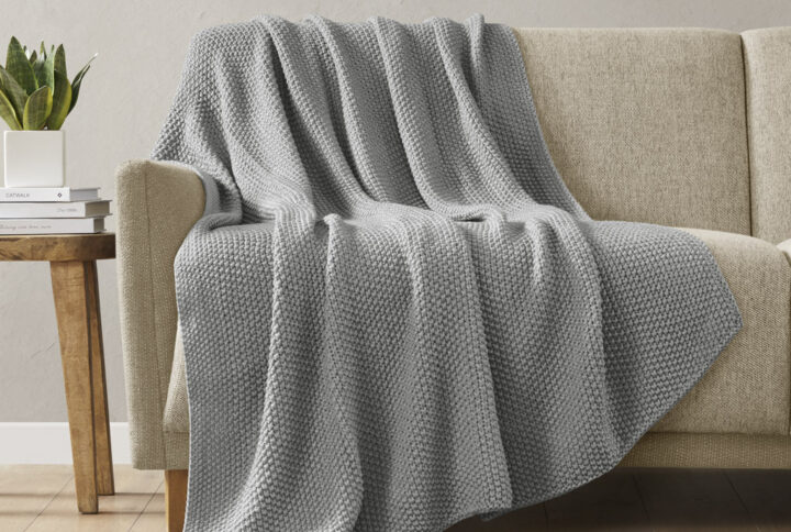 Bundle up in the warm and cozy comfort of the INK+IVY Bree Knit Throw. This ultra-soft