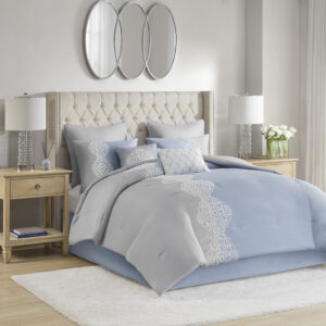 Elegance and glam are brought together in the beautiful transitional design of this luxury comforter set. Soft gray and blue colors are accented by coordinating white floral embroidery to create an understated and charming look. The solid gray reverse complements the top of the bed and gracefully tailored shams match the delicate style of the comforter. Elevate your bedroom with the refreshing style and lush comfort of this embroidered comforter set.