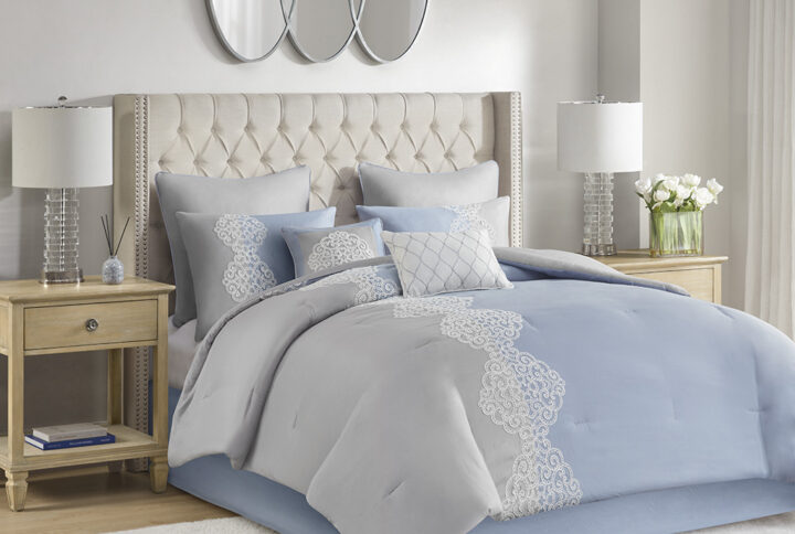 Elegance and glam are brought together in the beautiful transitional design of this luxury comforter set. Soft gray and blue colors are accented by coordinating white floral embroidery to create an understated and charming look. The solid gray reverse complements the top of the bed and gracefully tailored shams match the delicate style of the comforter. Elevate your bedroom with the refreshing style and lush comfort of this embroidered comforter set.