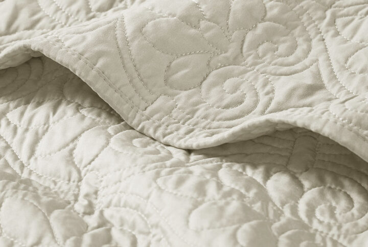 Quebec's classic stitch pattern pairs easily with your existing décor and adds a new decorative element to any room. The oversized quilted throw has 100% cotton fill and is soft to the touch.