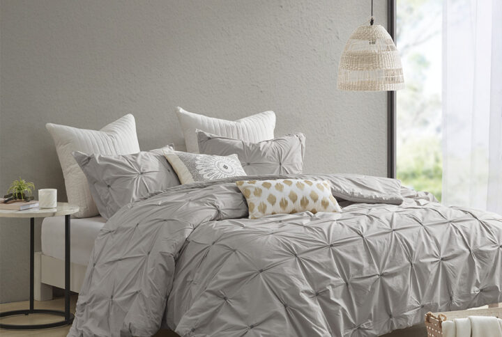 Elevate your bedroom with the INK+IVY Masie 3 Piece Elastic Embroidered Cotton Comforter Set. This solid cotton comforter features elastic and embroidered details on the face to create a tufted-inspired design with a modern flair. Hidden bartacking in the comforter secures the filling and creates a clean duvet-like finish. The 2 matching shams handsomely pair with the cotton comforter to complete this modern and sophisticated comforter set. This cotton bedding set uses an antimicrobial treatment that provides built-in freshness protection