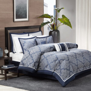 The Madison Park Medina Collection provides a unique update to your bedroom. Its woven jacquard fabrication uses silver thread on a navy blue base creating a beautiful key design on your top of bed. Two solid euro shams and three decorative pillows using embroidery and fabric manipulation to tie this look together.