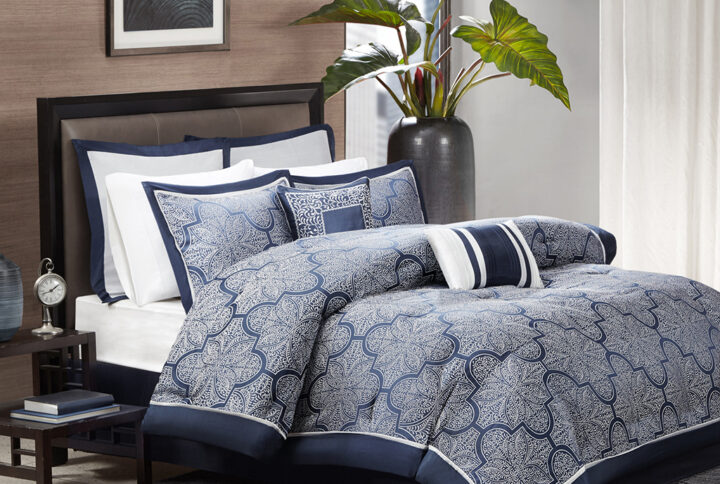 The Madison Park Medina Collection provides a unique update to your bedroom. Its woven jacquard fabrication uses silver thread on a navy blue base creating a beautiful key design on your top of bed. Two solid euro shams and three decorative pillows using embroidery and fabric manipulation to tie this look together.