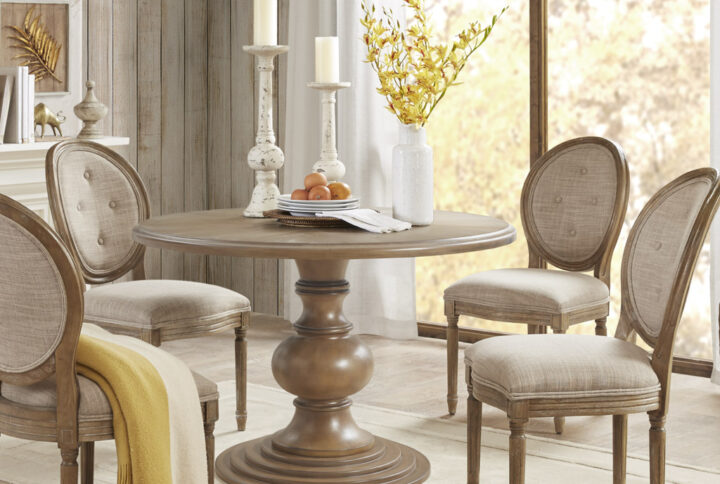 Bring a warm and inviting update to your kitchen with the farmhouse charm of this round dining table. The wood veneer table top features a diamond design with natural wood grain variation to create a unique and more casual design. A turned