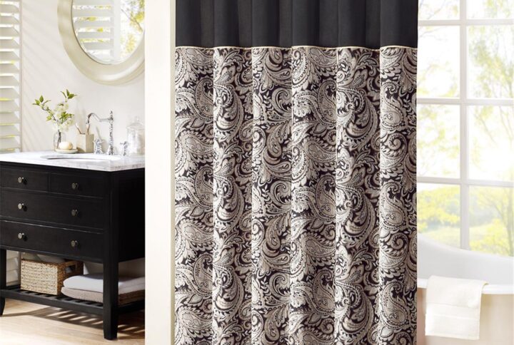 The Madison Park Aubrey Polyester Jacquard Shower Curtain creates a sophisticated modern look in your bathroom. The pieced design flaunts a beautiful woven jacquard in an updated paisley motif with a large solid stripe at the top of the shower curtain. This jacquard shower curtain is machine washable for easy care. Complete the collection and look with coordinate bath towels