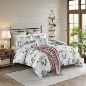 The Madison Park Zennia 7 Piece Printed Seersucker Comforter Set with Throw Blanket offers a charming farmhouse update for your bedroom. The textured seersucker comforter features an all-over floral print in soft blush and taupe hues on the white base