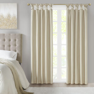 Energy efficiency meets a sophisticated style with the Madison Park Emilia Twist Tab Total Blackout Window Curtain. This window curtain panel showcases a DIY twist tab top finish that allows you to create an elegant display in your living room or bedroom space. The faux silk sheen base fabric features a 3 pass foamback liner on the reverse to block out all outside light