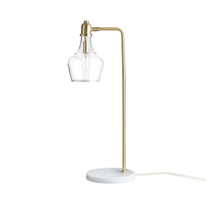 this table lamp features a gold metal finish with a marble base that creates an elegant and beautiful design. A clear glass bell-shaped lamp shade allows the light to shine brightly in your home office