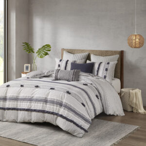 The INK+IVY Cody 3 Piece Cotton Duvet Cover Set brings a smart combination of texture and style to your bedroom. This 100% cotton duvet cover features a grey and navy striped print with pompom and trim details for a casual