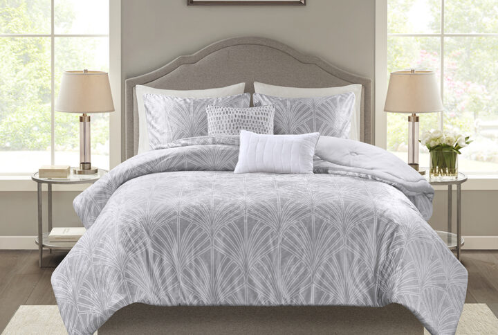 Give your bedroom a luxurious update with the Beautyrest Kiona 5 Piece Crushed Velvet Comforter Set. The oversized silver crushed velvet comforter set features an art deco pattern for an elegant bedroom style. Embroidered abstract patterns in the square pillow and oblong pillow add the finishing touches to complete the look. Machine washable for easy care