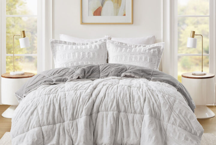 Sleep in the pure softness and comfort of the Madison Park Gia Back Print Long Fur Comforter Mini Set. The ultra-soft grey comforter flaunts a stylish brushed faux fur on the face that flips to a soft faux mink reverse